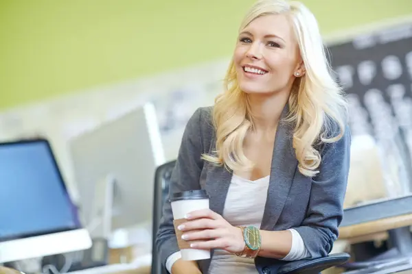 Woman, office and employee with happiness in desk as hr manager with coffee for break and relax. Portrait, female person and smile with commitment for job, career growth and opportunity at work