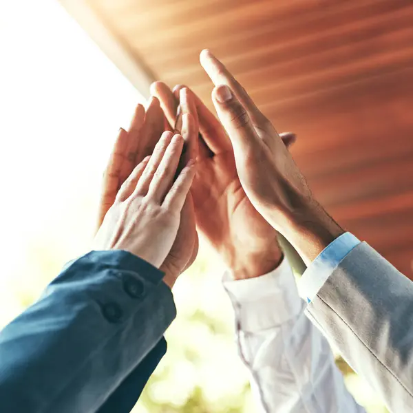 stock image High five, people and hands for collaboration, success and celebration for work achievement, goal and job well done. Trust, partnership and winner for teamwork, target and motivation or team building.