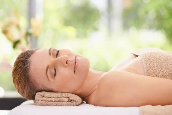 Woman, face and peace at spa, massage and wellness with calm and self care for bodycare. Cosmetics, beauty and facial, relax with eyes closed at luxury resort and treatment for stress relief.