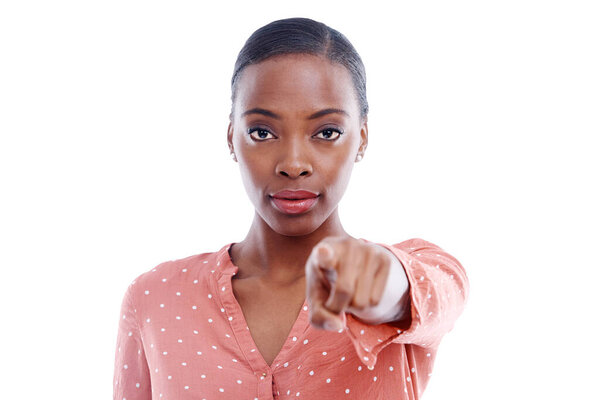 Studio, serious face and portrait of black woman with point for decision, choice and blame you. African person, hand and gesture with vote for warning, suspicious and selection on white background.