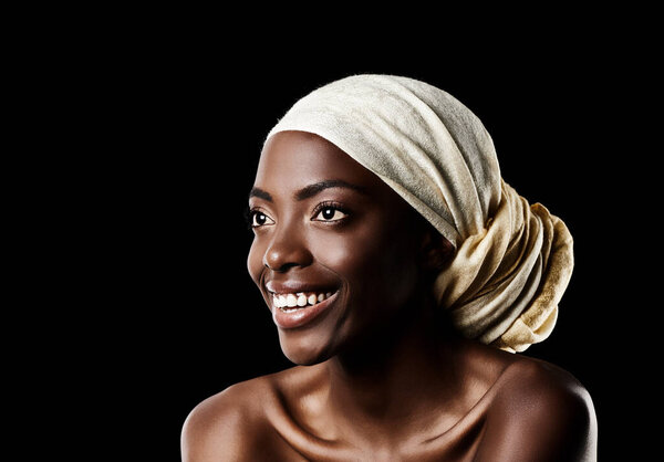 Beauty, smile and black woman with head scarf, natural makeup or creative aesthetic in mockup space. Art, skincare and happy African girl on dark background with wrap, facial cosmetics and confidence.