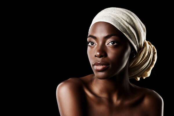 Beauty, glamour and black woman with head wrap, natural makeup or creative aesthetic in studio mockup. Art, skincare and African queen on dark background with scarf, facial cosmetics and confidence