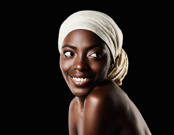 Beauty, studio and happy black woman with headscarf, natural makeup or creative aesthetic in mockup space. Art, skincare and African girl on dark background with wrap, facial cosmetics and confidence.