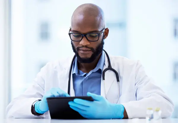 Black man, doctor and tablet for results or report as healthcare worker. Prescription, cardiologist and internet website for information or treatment guidelines, appointment and online schedule.