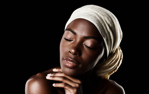 Beauty, relax and black woman with head wrap, natural makeup or creative aesthetic in studio mockup. Art, skincare and African girl on dark background with scarf, facial cosmetics and confidence