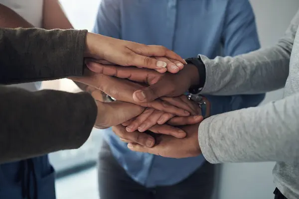 Stock image Hands stack, team work and group with support, collaboration and love or care and solidarity in therapy. People standing together with unity, compassion and helping for psychology and mental health.