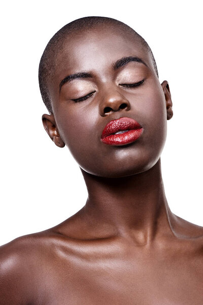 African, beauty and makeup on face in studio on white background with glow on skin from dermatology. Calm, model and lipstick from cosmetics and black woman with healthy skincare in mockup space.