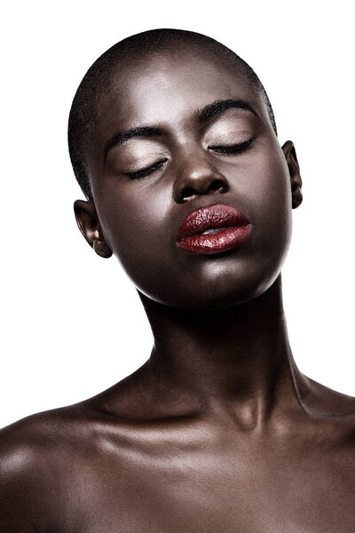 African, face and beauty from skincare or makeup in studio on white background with glow on skin. Calm, model and lipstick from cosmetics and black woman relax with dermatology in mockup space.