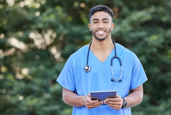 stock image Man, portrait and tablet for outdoor doctor, hospital website and search for medical information. Female person, confident cardiologist and app for telehealth, digital patient charts and insurance.