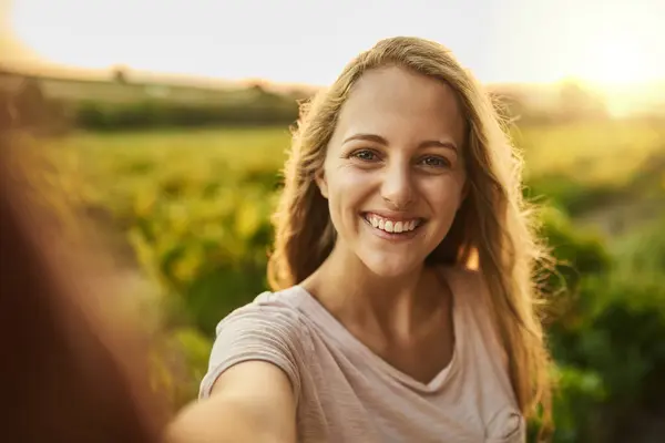 stock image Selfie, woman and eco travel portrait with social media and influencer on volunteer program for agriculture. Smile, outdoor and sustainable farming in Argentina for a charity NGO for environment.