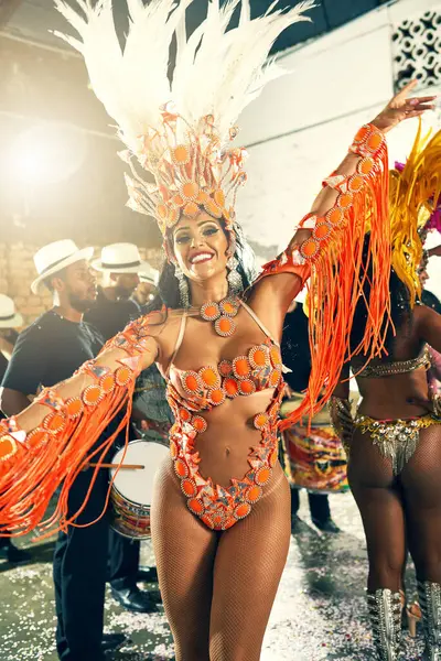 Stock image Band, dancer and woman for celebration, carnival and costume for samba. Performance, Mardi Gras and culture in Brazil for female person and festival of life, concert and local show with musician.