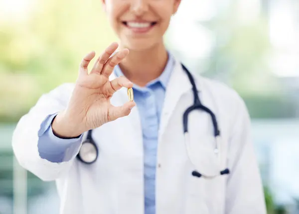 stock image Medicine, medical or hand of doctor with pill, vitamin or pharmacy supplements for life extension. Mental enhancer, performance or person with drugs or medication tablet for health or okay gesture.