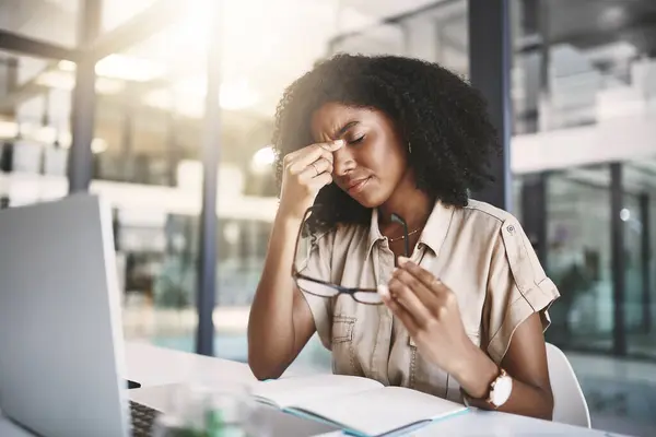 stock image Office, black woman and eye strain with headache for stress, poor ergonomics and digital fatigue of writer. Workplace, pain and migraine of journalist for business, article deadline and tired.