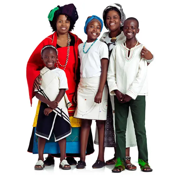 stock image Tradition, African and woman or family in studio with culture, heritage and history on a white background. Excited mothers day celebration with kids in portrait for love, care and indigenous fashion.