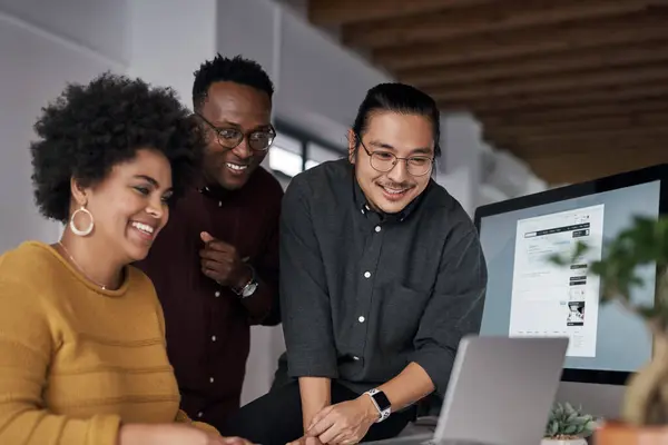 stock image Smile, team and business people with computer in office for communication, info and reading email. Diversity, company and employees with tech at work for ux rollout, web development or project launch.