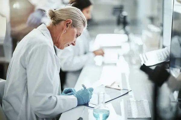 stock image Clipboard, woman and scientist writing in laboratory for medical research on cancer drug trial. Checklist, investigation and female biologist with clinic protocol development for pharmaceutical study.