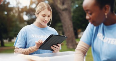 Tablet, volunteer and people in park for checklist at charity event, community service and teamwork. Volunteering, ngo group and women on digital tech for social media, website and online inventory. clipart