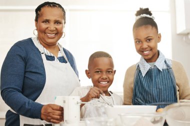 Happy family, portrait and kitchen with children for baking dessert or childhood development at home. Grandmother, young kids or junior bakers with smile for mixing ingredients or learning at house. clipart