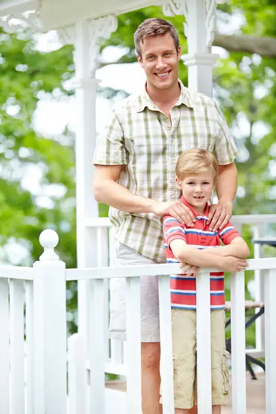 Home, boy and portrait with dad on balcony for support, bonding and care in Canada. People, parent and smile with kid as family on break with love, trust and relax for child growth and development.