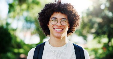 Man, student and happy for portrait at park, pride and excited on commute to university in spring. Person, smile and backpack on path for scholarship, learning or education at college in Costa Rica. clipart