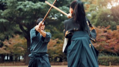 Weapon, Japanese people and outdoor for martial arts or aikido in training, exercise and sports. Students, wooden sword and heritage for challenge, combat and practice as defense technique or bojutsu. clipart