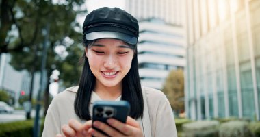 Happy, asian woman or travel with phone in city for communication, destination or location app. Japan, female person or tourist with smile on mobile smartphone for nagivation or tourism in urban town. clipart