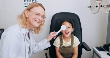 Doctor, occluder or kid in eye test at optometry clinic for eyewear, health or sight wellness. Tools, smile or happy child in assessment for optical diagnosis, vision exam or spectacles with object. clipart