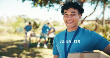 Man, excited and portrait of volunteer in nature with community service, NGO or donation project. Happy, confident and face of male charity worker with confidence outdoor in field for social activism. clipart