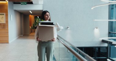 Sad, corporate and woman walk with box for work dismissal, fired and retrenched of unemployment. Unhappy, female person and items for resignation, termination eviction and recession notice of jobless. clipart