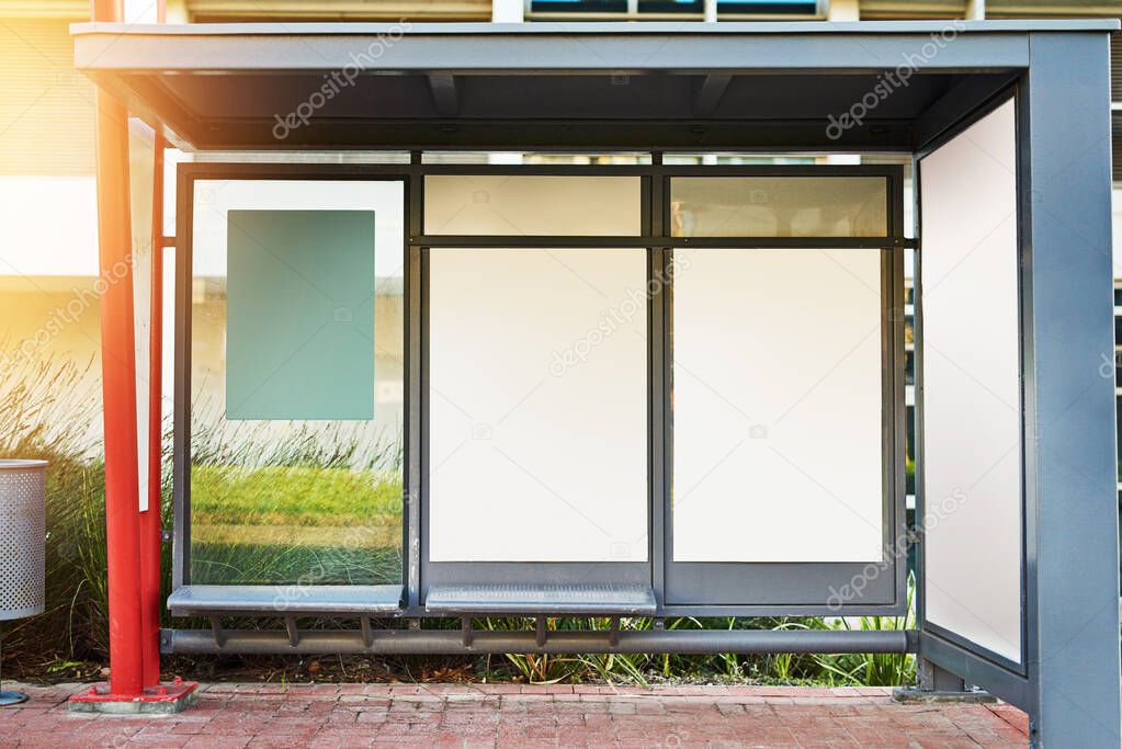 Road sign, billboard and street with bus stop or mockup space for advertising, message or notification in city. Empty poster, banner or post for brand, logo or marketing on sidewalk in an urban town.