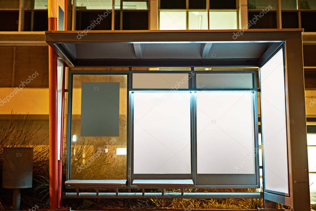 Street sign, billboard and night with bus stop or mockup space for advertising, message or notification in city. Empty poster, banner or post for brand, logo or marketing on sidewalk in late evening.