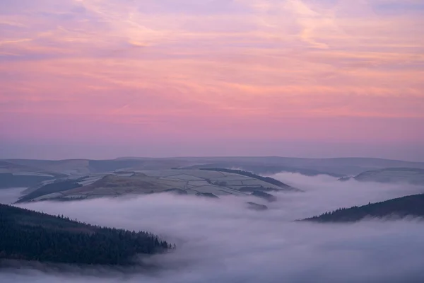 Bamford Edge. Ladybower, and Hope Valley winter sunrise temperature inversion in the Peak District National Park, England, UK.