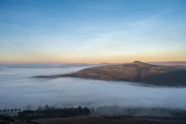 Bamford Edge. Ladybower, and Hope Valley winter sunrise temperature inversion in the Peak District National Park, England, UK.
