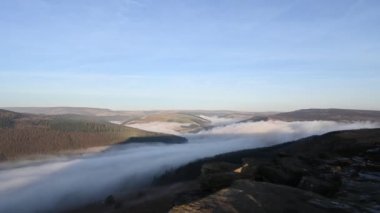 Timelapse of Bamford Edge. Ladybower, and Hope Valley winter sunrise temperature inversion in the Peak District National Park, England, UK.