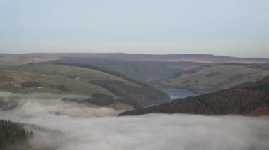 Timelapse of Bamford Edge. Ladybower, and Hope Valley winter sunrise temperature inversion in the Peak District National Park, England, UK.