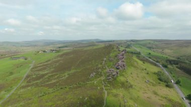 Pullback and reveal b-roll aerial drone footage from of Ramshaw Rocks in the English Peak District National Park, UK.
