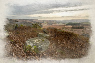 Stanage Edge millstones in the Derbyshire Peak District National Park during winter. clipart