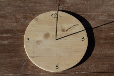 Image of a hand built sun shade clock. clipart