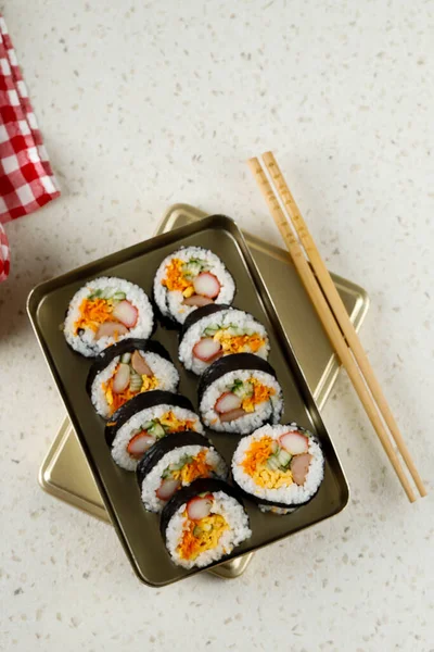 Kimbap, Korean Style Rolled Rice Sushi on Korean Traditional Metal Lunchbox