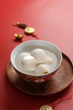 Tangyuan, Sweetened Glutinous Black Sesame Ball Soup. Eaten During Lantern Festival, Wedding, Family Reunion and in Winter Solstice clipart