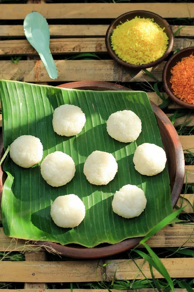 Steamed Sticky Rice Ball, Usually Topped with Spicy or Sweet Shredded Coconut. Thai Asian Dessert