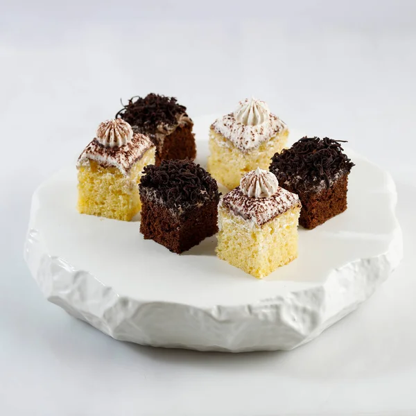 Vanilla and Mocca Sponge Cake Slice or Cake Potong on White Stone Plate