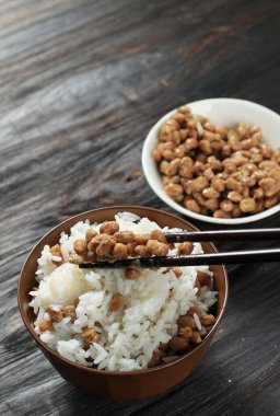 Natto over White Rice, on Wooden Table