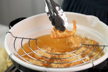 Cooking Process: Frying Oyster Mushroom Making Crispy Mushroom in Hot Oil.