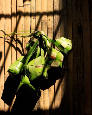 Ketupat and Ied al Fitr Cake (Kue Lebaran) Food Festive for Family in Indonesian or Malayasia Moslem Culture. COpy Space for Text 
