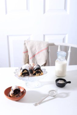 Marble Cake with Coffee with Powder Sugar and Kitchen Vintage Utensil, White Bakery Concept