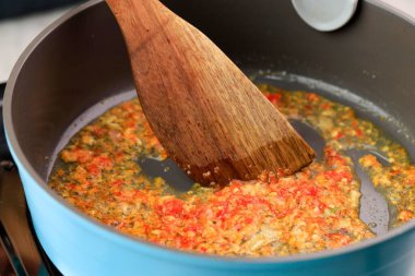 Cooking Process Saute Sambal or Sambel or Spicy Sauce on a Pan in the Kitchen, Goreng Sambal