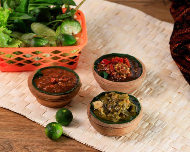 Sambal Dadak, SAmbal Ijo, Sambal Terasi Usually find at Sundanese Restaurant. This Three Various Sambal Free Flow for Customer, Served on Mini Wooden Mortar. 
