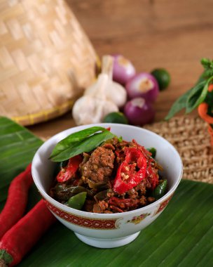 Stir Fry Oncom (Fermented Soy Bean) with Red and Green Chilli. Sambal Oncom is Typically Food from Sundanese, West Javam Indonesia. 