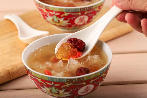 CLose Up Spoon with Peach Gum Collagen Dessert is a Chinese Traditional Refreshment Beverages. It is Contains Bird Nest, Red Dates, Snow Fungus, Goji Berry.